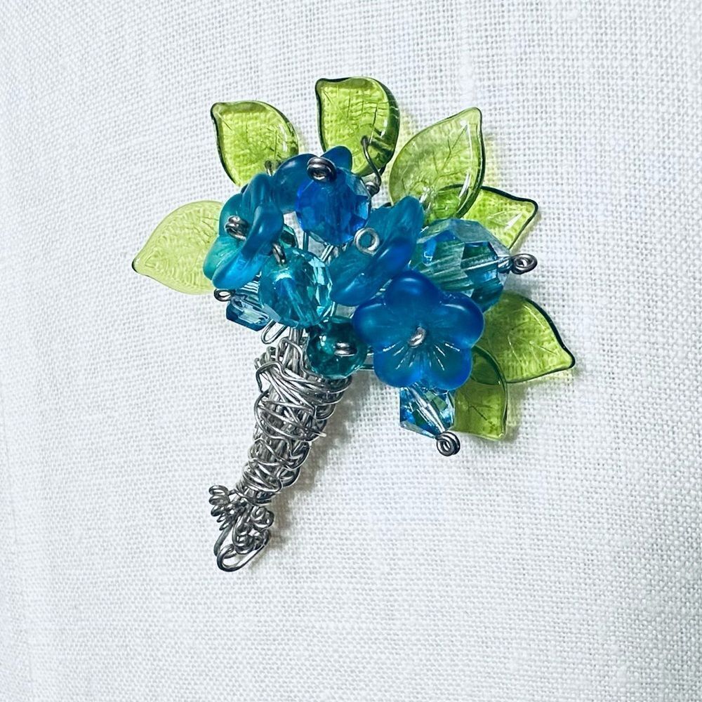 Vintage art glass flower bouquet on silver tone hand wired lapel pin brooch.